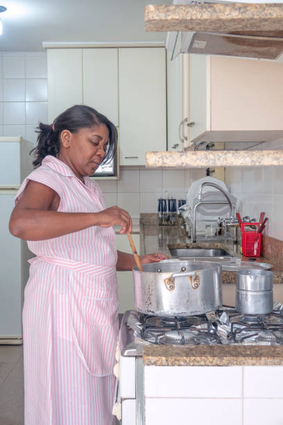 istock Brazilian maid cooking 1021253116