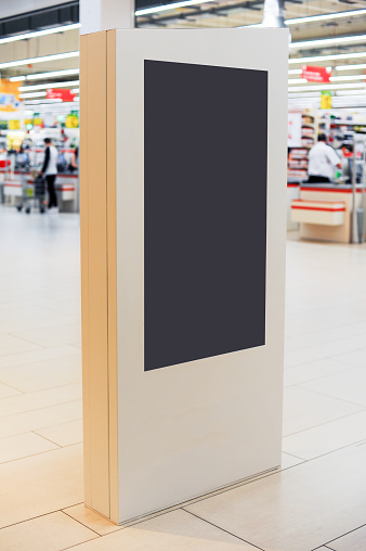 Mockup of digital white screen panel. Blank  modern media billboard in the shopping center. Place for text, advertising or public information.