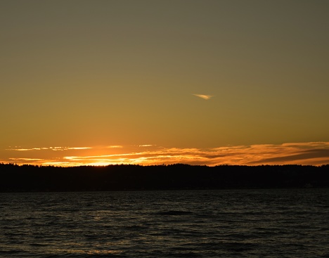 The skies are on fire at Mukilteo, Washington as the sun sets on Puget Sound.