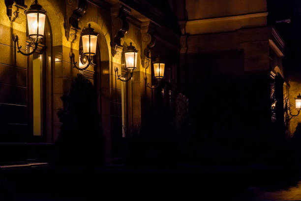 istock Old lanterns on a wall of the house 1021288630