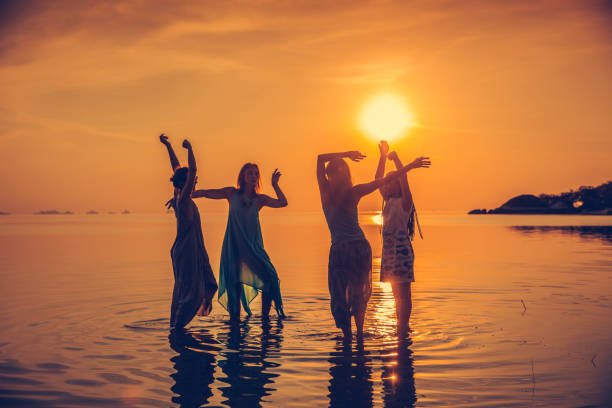 Crowd people friends sunset beach holidays