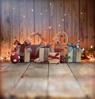 Christmas eco friendly gift boxes and decorations on an old wooden background. Low angle view and shallow depth