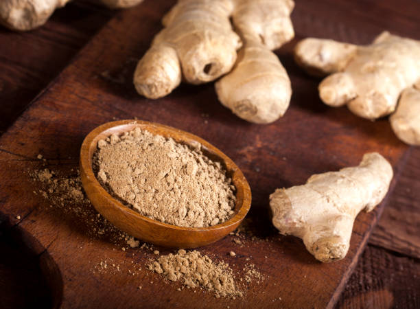 istock Ginger root and ginger powder on wooden background 1021301400