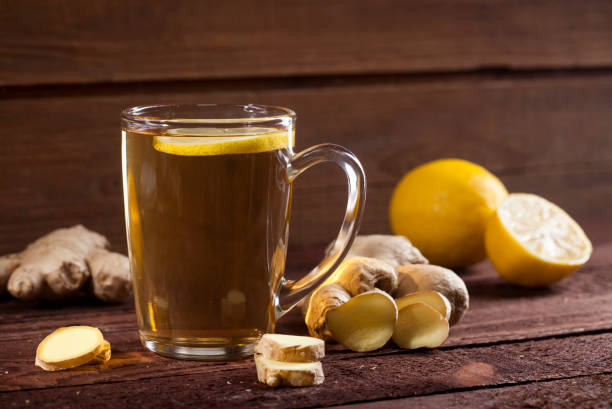 istock Ginger tea with lemon on wooden background 1021301406