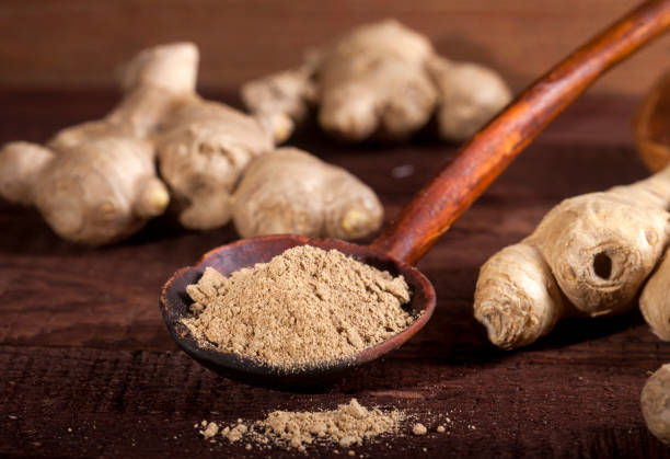 istock Ginger root and ginger powder on wooden background 1021301412