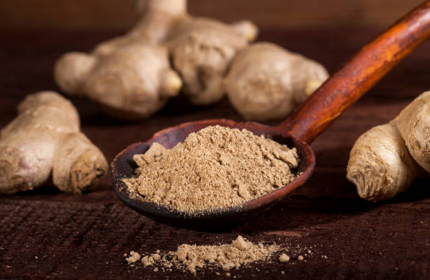 istock Ginger root and ginger powder on wooden background 1021301414