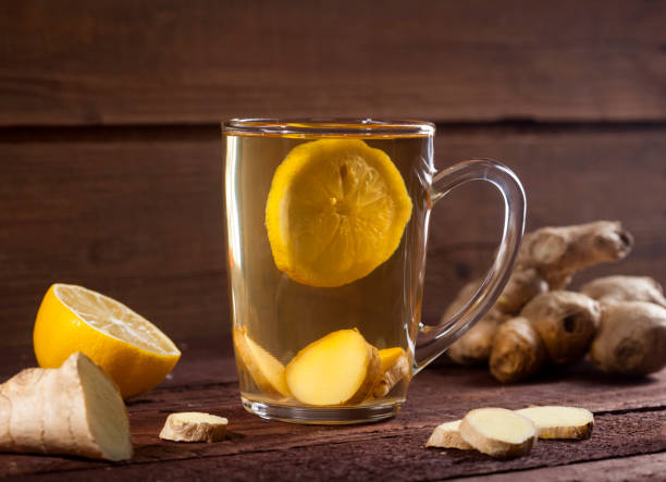 istock Ginger tea with lemon on wooden background 1021301426