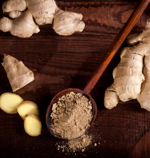 istock Ginger root and ginger powder on wooden background 1021301432