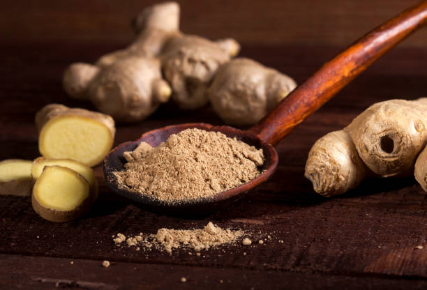istock Ginger root and ginger powder on wooden background 1021301454