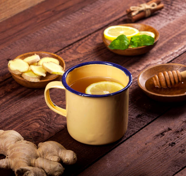 istock Ginger tea with lemon, mint and honey on wooden background 1021301460