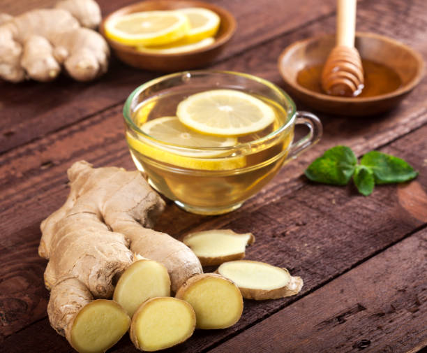 istock Ginger tea with lemon, mint and honey on wooden background 1021301478