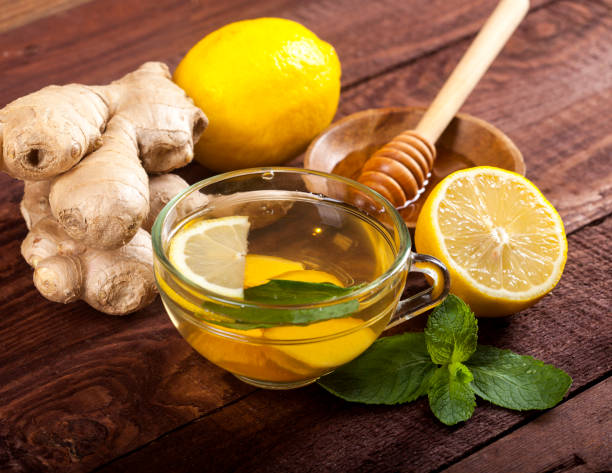 istock Ginger tea with lemon, mint and honey on wooden background 1021301490