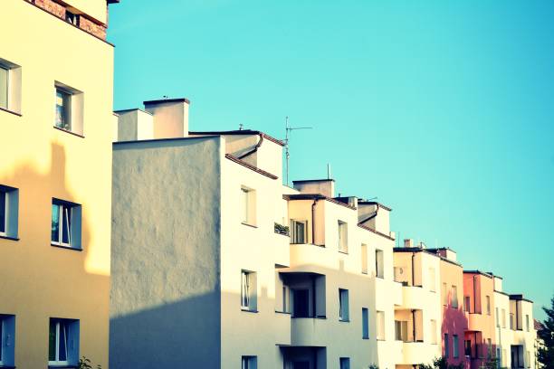 istock Modern apartment building exterior. Retro colors stylization 1021307768