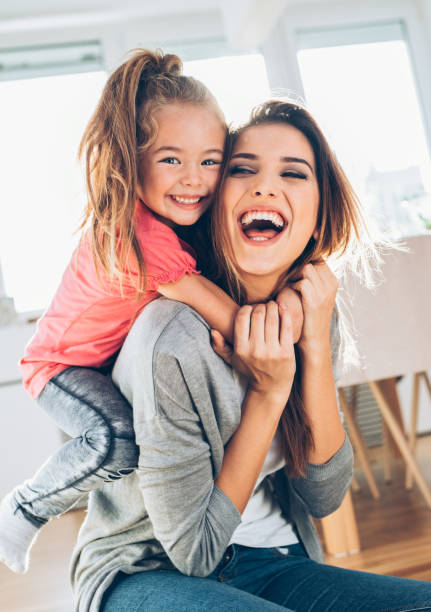istock Mother and daughter having fun at home 1021308360