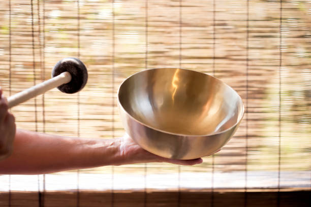 istock Girl holding a Tibetan bowl & striker 1021312778