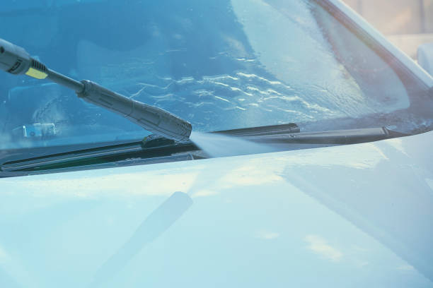 istock Summer Car Washing. Cleaning Car Using High Pressure Water 1021317738