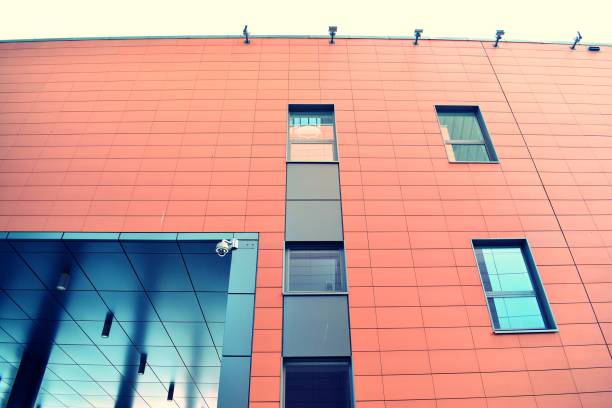 istock Modern office building on a clear sky background. Retro stylized colorful tonal filter effect 1021317740