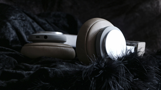 Hifi Music Wireless headphones on soft furry clothes