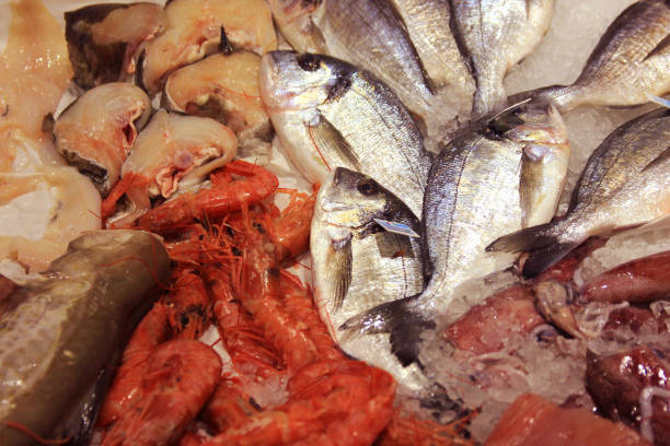 istock Fresh fish and seafood arrangement on shopboard 1021325468