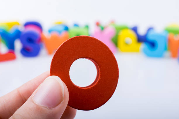 istock Hand holding Letter cube  O of  Alphabet 1021325768
