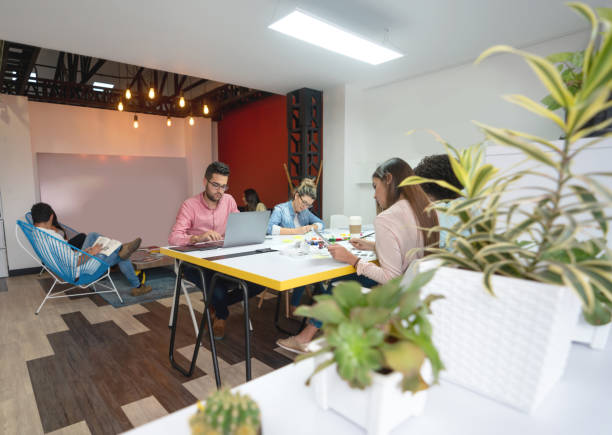 istock Group of casual business people working at a co-working space 1021334538