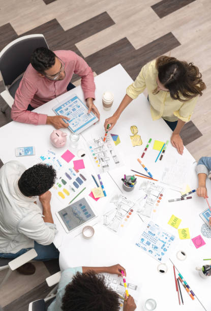 istock Group of designers sharing ideas at a creative office 1021336824