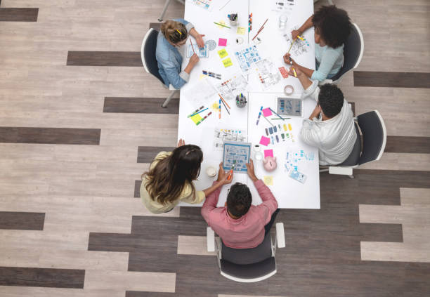 istock Group of designers sharing ideas at a creative office 1021336838