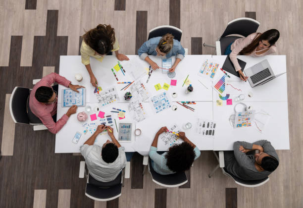 istock Group of business people sharing ideas at a creative office 1021336866