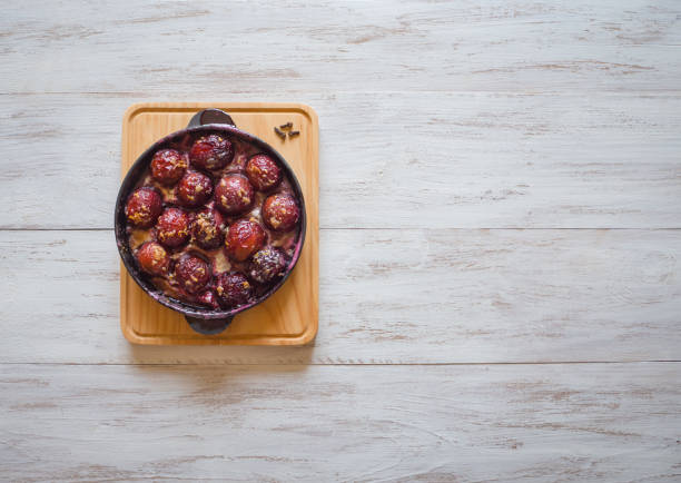 Plum dessert with honey, cinnamon and cloves
