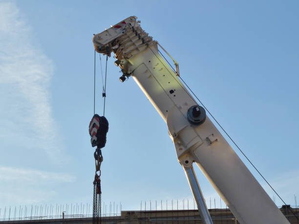 istock White arrow of a powerful construction car crane 1021347742
