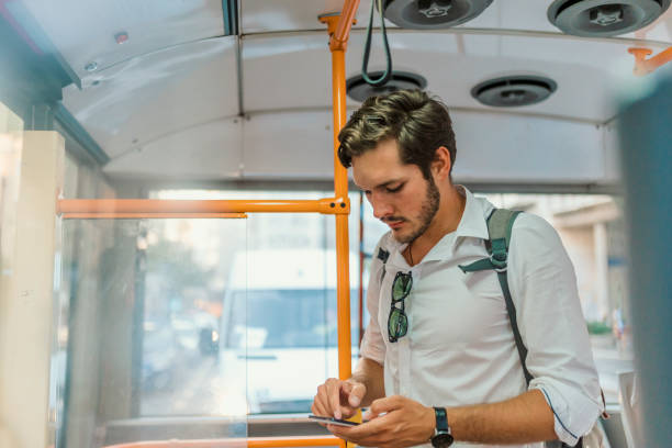 istock Handsome male is looking at the screen of a mobile phone while texting. 1021348014