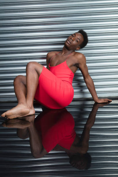 istock Crossdressing man wearing a red dress 1021350814