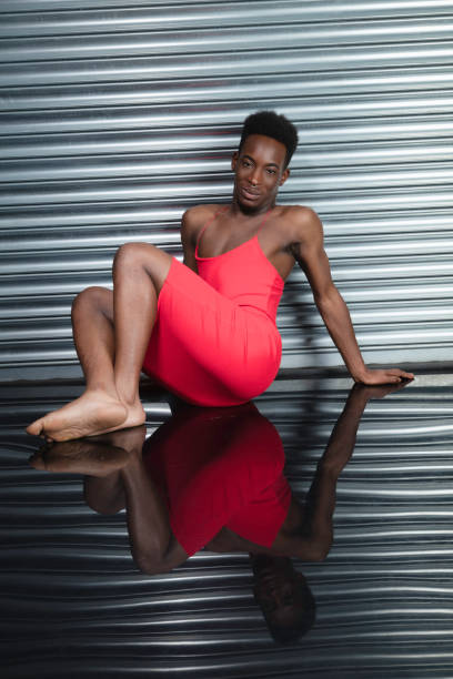 Crossdressing man wearing a red dress