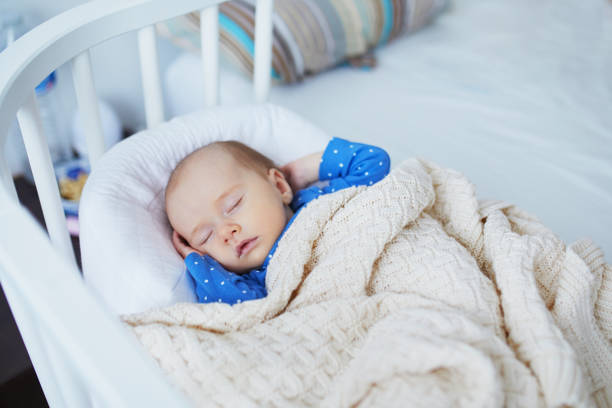 istock Adorable baby girl sleeping 1021356040
