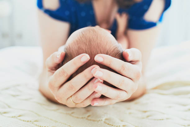 istock Mother bonding with her newborn baby 1021356734