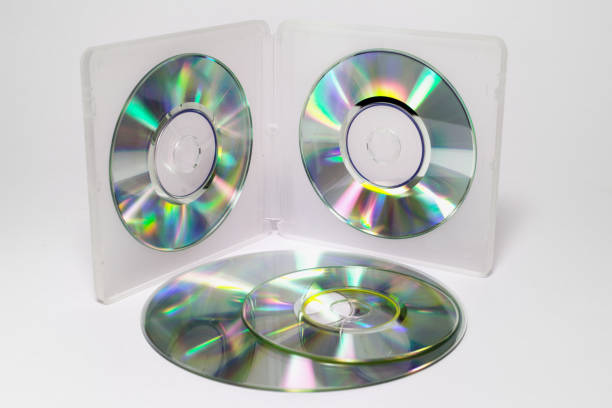 istock case for mini CDs. inner trays of double-sided semitransparent plastic box with iridescent discs on clips and the stack of different sizes discs. with clipping path 1021361982
