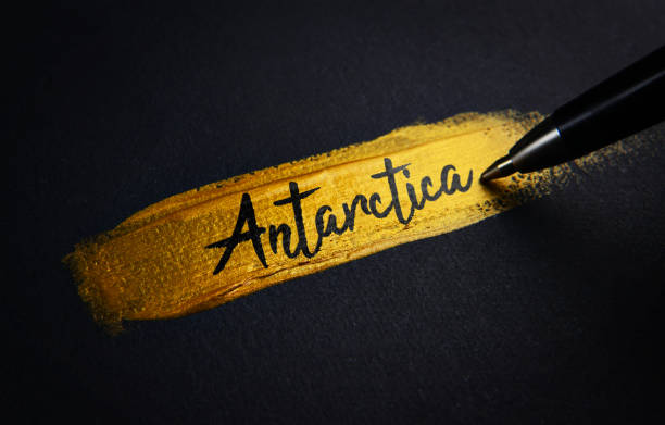 istock Antarctica Handwriting Text on Golden Paint Brush Stroke 1021374566