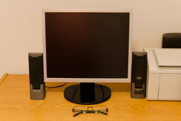 istock desk with computer monitor and glasses 1021374904