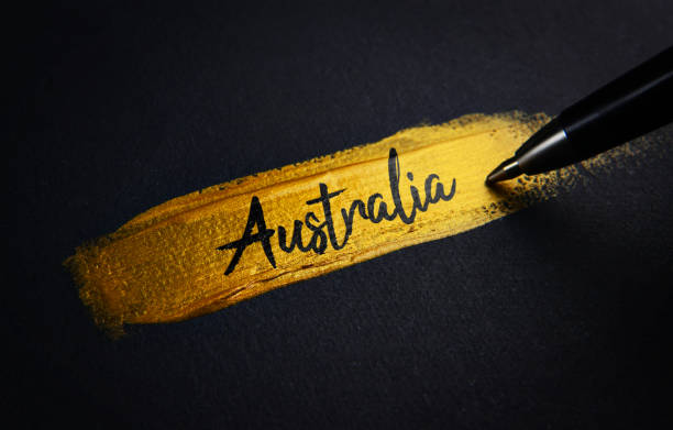 istock Australia Handwriting Text on Golden Paint Brush Stroke 1021375030
