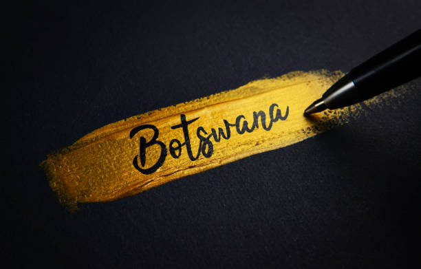 istock Botswana Handwriting Text on Golden Paint Brush Stroke 1021375578
