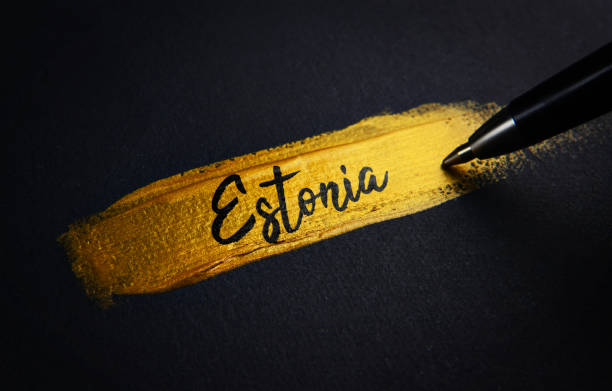 istock Estonia Handwriting Text on Golden Paint Brush Stroke 1021380714