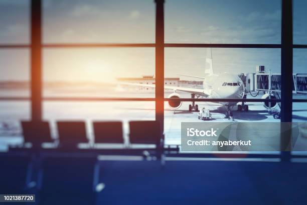 Airplane Waiting For Departure In Airport Terminal Stock Photo - Download Image Now - Airport, Airplane, Backgrounds