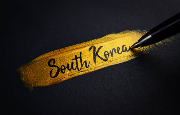 istock South Korea Handwriting Text on Golden Paint Brush Stroke 1021387724