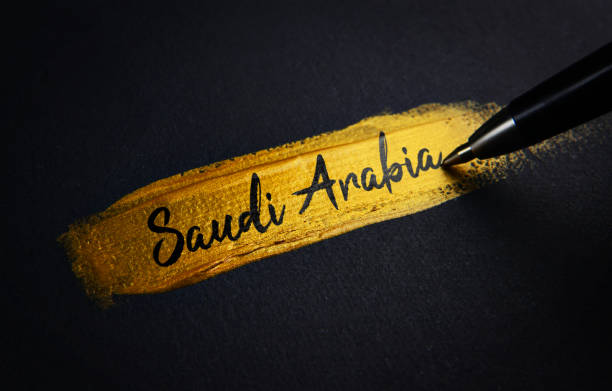istock Saudi Arabia Handwriting Text on Golden Paint Brush Stroke 1021395314