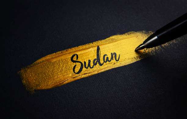istock Sudan Handwriting Text on Golden Paint Brush Stroke 1021397518