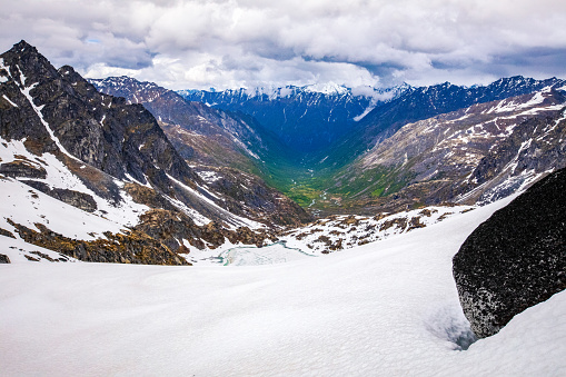 Dramatic high-angle photo of beautiful curvy mountain pass with idyllic view of mountain valley in Western Norway, Scandinavia