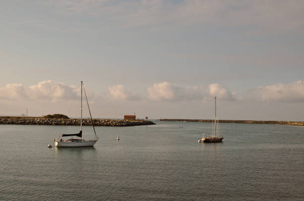 istock Two sailboats moored in a bay 1021448192