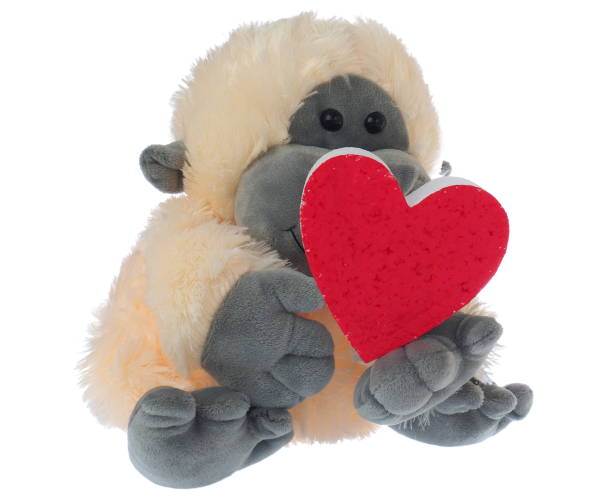 istock monkey stuffed soft toy holding red heart symbol on white background 1021471218