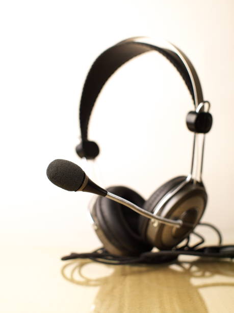 istock headset, focus on microphone, shallow depth of field 1021476480