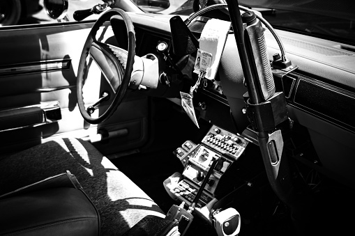 Vintage interior of an old police car in black and white.
